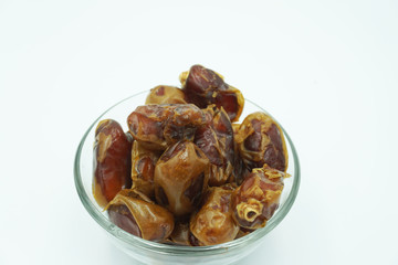 Kurma or dates fruits isolated on white background