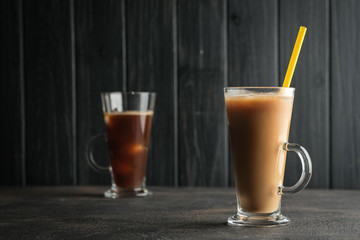 Ice coffee on a dark background with copy space.