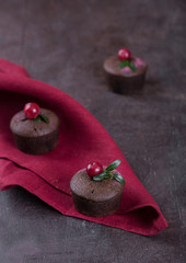 Chocolate fondant with cherry on a cherry tablecloth