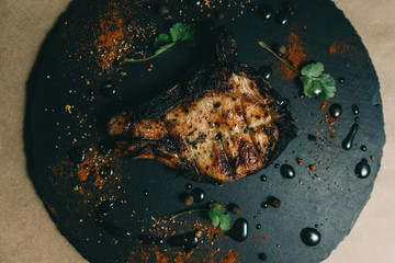 Pork bone steak on a wooden background with honey. Board slate. kenza, pepper