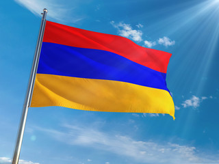 Armenia National Flag Waving on pole against sunny blue sky background. High Definition