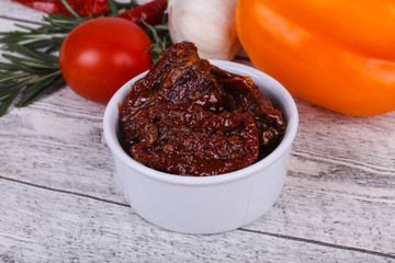 Dried tomatoes in the bowl with olive oil