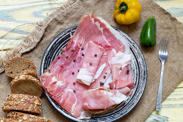 Pieces of Italian prosciutto on a plate