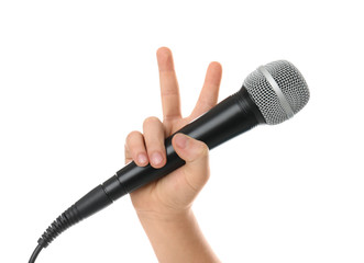 Child holding microphone on white background, closeup of hand