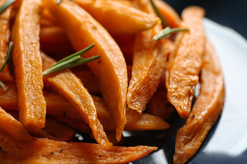 Closeup view of plate with tasty sweet potato fries