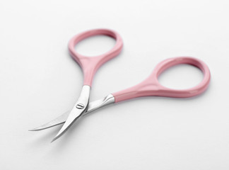 Pair of nail scissors on white background