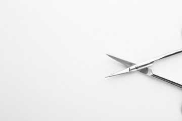 Pair of nail scissors on white background