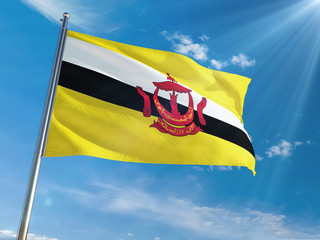 Brunei National Flag Waving on pole against sunny blue sky background. High Definition
