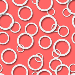Abstract seamless pattern of randomly arranged white rings with soft shadows on peach background