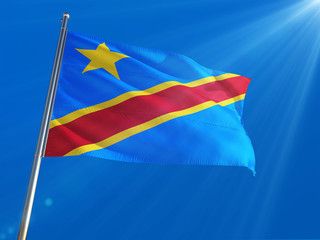 Congo National Flag Waving on pole against deep blue sky background. High Definition