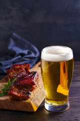 Beer and pork spare ribs. Beer and meat. Glass of ale. room for text, copy space