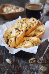 Italian cookies: pistachio and cranberries cantuccini and cup of coffee