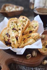 Italian cookies: pistachio and cranberries cantuccini and cup of coffee