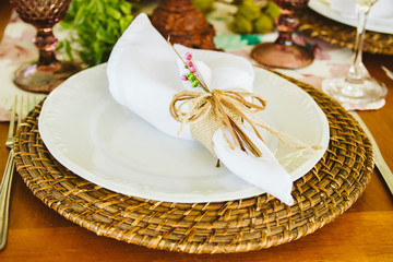 Wedding Setup. Banquet with table and chairs. Decoration, flowers, ware, glass