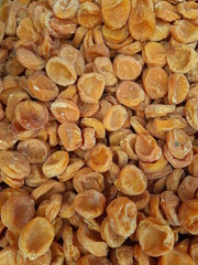 Dried peach dried apricots texture, top view background