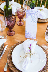 Wedding Setup. Banquet with table and chairs. Decoration, flowers, ware, glass