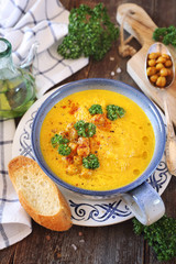 Vegetable carrot soup with chickpeas and roast baguette