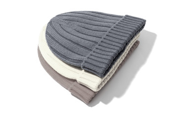 Trendy knitted beanies isolated on white background