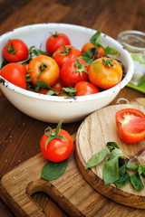 Ripe raw organic tomatoes in old style dish