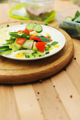 Summer salad served on a plate, cooking at home