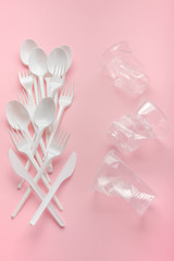 Plastic utensils, Forks, spoons, knives. Picnic dishes. not eco-friendly plastic. Environmental protection.