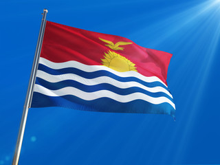 Fototapeta na wymiar Kiribati National Flag Waving on pole against deep blue sky background. High Definition