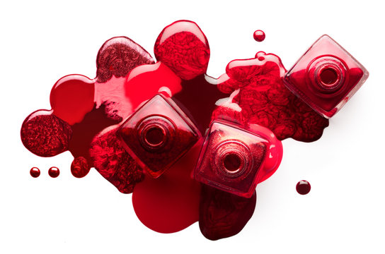 Red nail art cosmetics concept. Open nail polish bottles with different shades