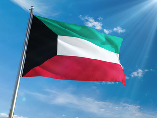 Kuwait National Flag Waving on pole against sunny blue sky background. High Definition