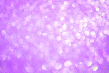 Bokeh blurred violet party background, Christmas and New Year holidays background. Party concept. Festive holiday card bright backdrop. Defocused. Flat lay, top view, copy space.