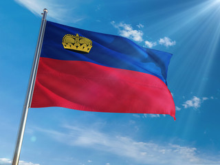 Liechtenstein National Flag Waving on pole against sunny blue sky background. High Definition