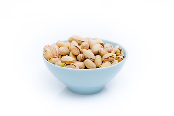 Pistachios in  bowls. Roasted pistachio seeds