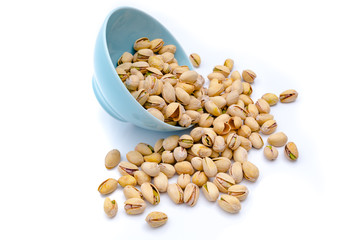 Pistachios in  bowls. Roasted pistachio seeds