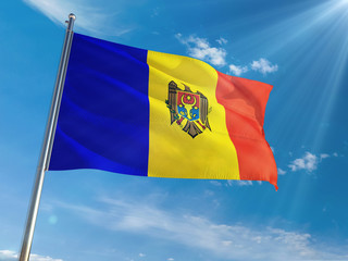 Moldova National Flag Waving on pole against sunny blue sky background. High Definition