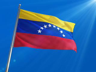 Venezuela National Flag Waving on pole against deep blue sky background. High Definition