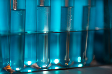 Test tube of glass overflows new liquid solution potassium blue conducts an analysis reaction takes various versions reagents using chemical pharmaceutics cancer manufacturing