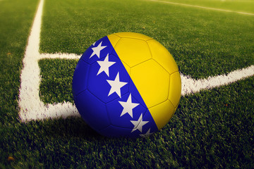 Fototapeta na wymiar Bosnia Herzegovina ball on corner kick position, soccer field background. National football theme on green grass.