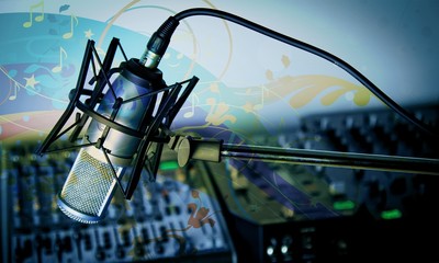 Microphone and  digital studio mixer  on background