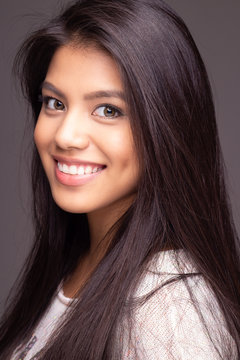 Head shot portrait of beautiful asian girl model smiling 