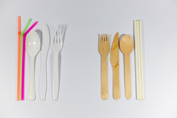Bamboo cutlery and paper straws isolated on white background, alternative, compared to single use...
