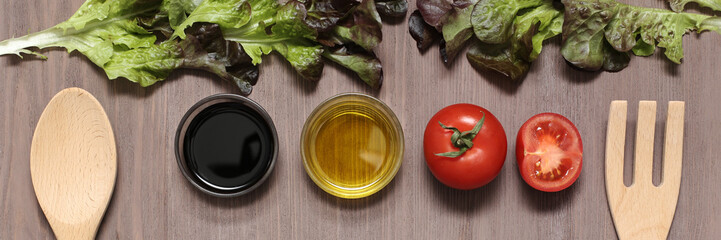 Salad mozzarella cheese tomatoes balsamic vinegar olive oil on a wooden board. Fresh food for diet product