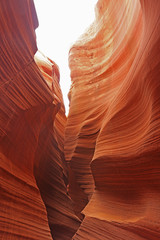 Rattlesnake Canyon in Arizona may not get the foot traffic as the famous Antelope Canyons and you may have to bend over to crawl in certain section.
