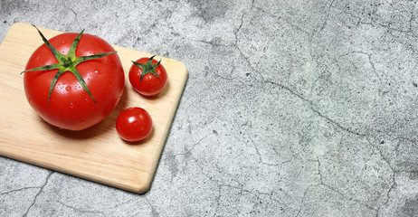 fresh tomatoes on a wooden board