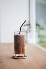 Ice coffee on wooden table