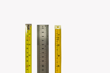 Tape measure, stainless steel ruler and dressmakers tape, isolated on a white background