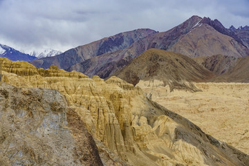 Landscape of Moonland and village in Lamayuru at Leh Ladakh, India. The moonland is famous for its formation and texture which looks like a part of the moon on the earth.