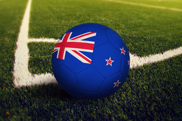 New Zealand ball on corner kick position, soccer field background. National football theme on green...