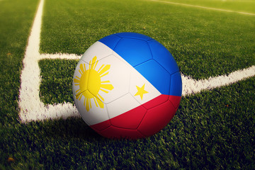 Philippines ball on corner kick position, soccer field background. National football theme on green...