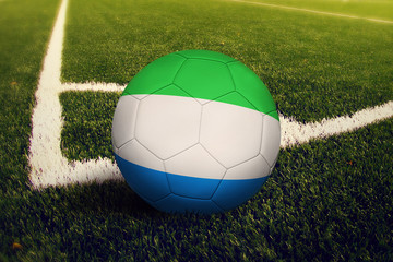 Sierra Leone ball on corner kick position, soccer field background. National football theme on...