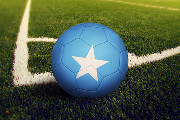 Somalia ball on corner kick position, soccer field background. National football theme on green...