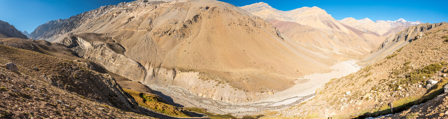 Andes valleys inside central Chile at Cajon del Maipo amazing views over snow mountains and glaciers a perfect place for hiking and having some adventure on a remote place with an awe rugged landscape